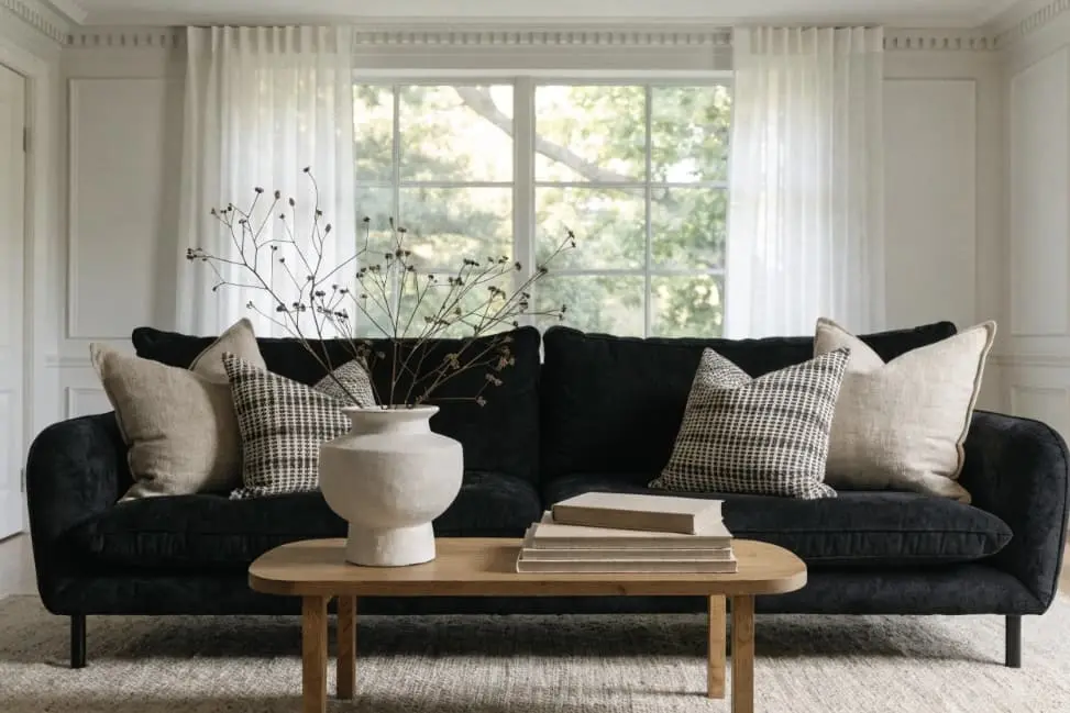 living room with black couch